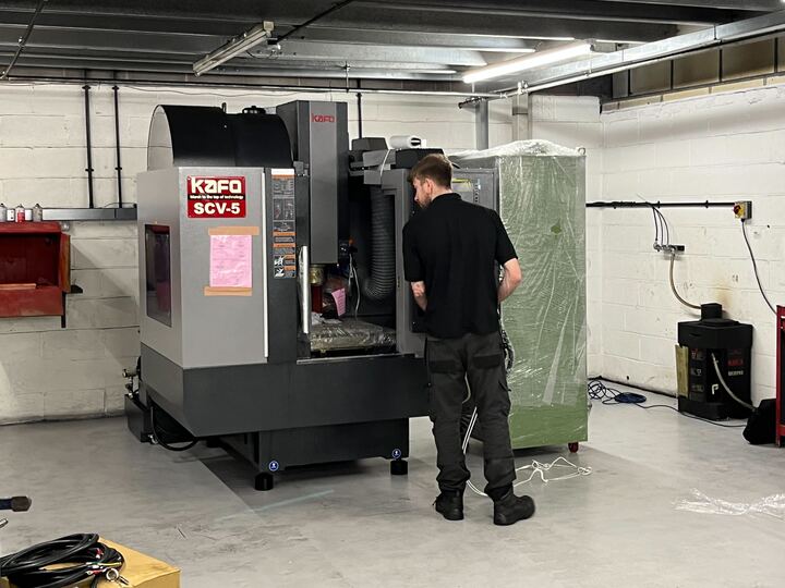 Employee working on machine