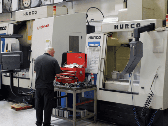 Employee working on Hurco CNC machine